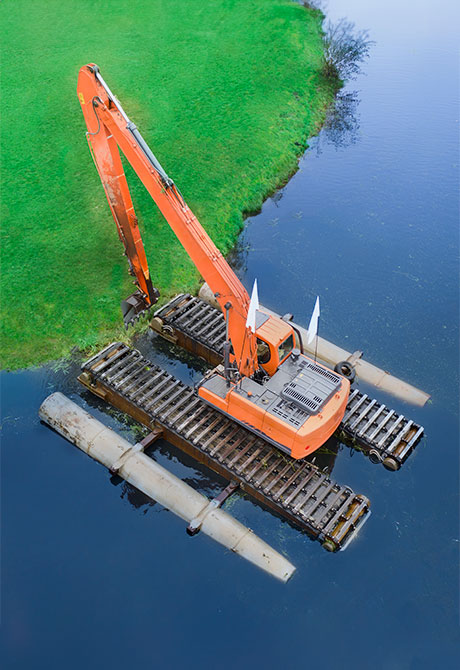 Image: Battelle PFAS expert examining water at a remediation site