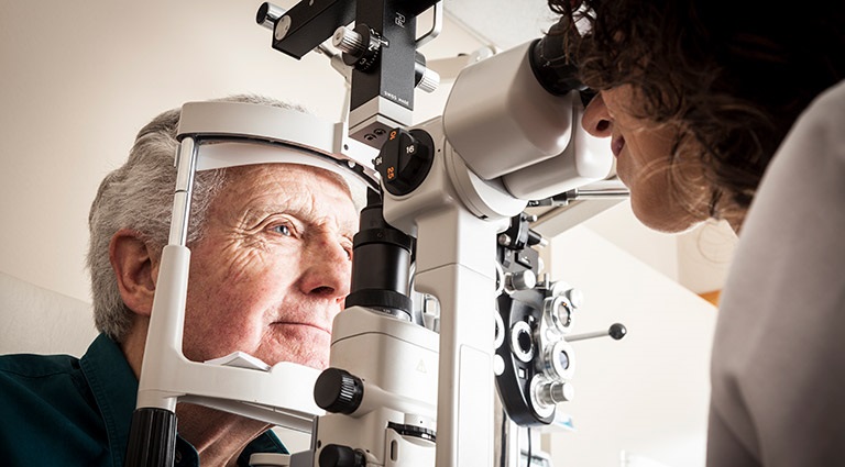Photo: Elderly person getting fitted for intraocular lens technology
