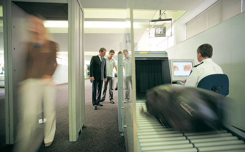 correct-technologies-featured Photo: Luggage going through scanner