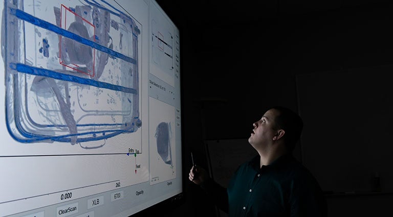 Photo: Aviation security expert scanning luggage with ProDetect