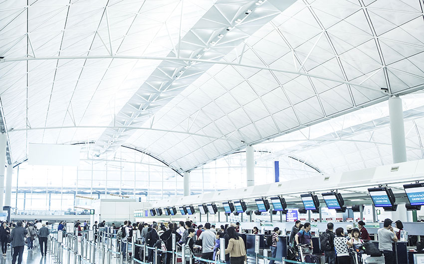 Photo: People scanning in their luggage