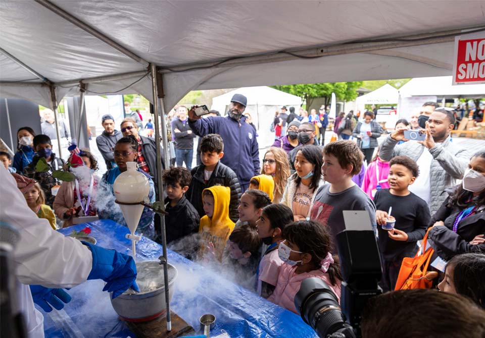 STEM Philanthropy Photo: three stem students observing a chemistry project