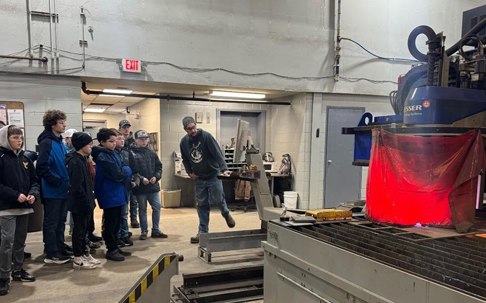 alt=students on a visit to a local Maritime Industrial Base business/manufacturer