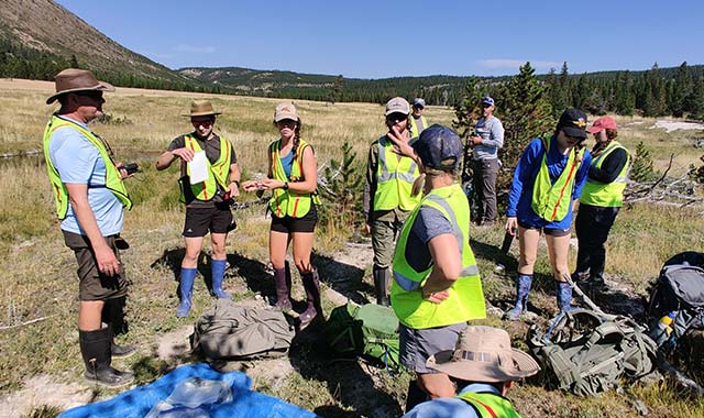 Photo: Undergraduate students in Montana State University’s ‘Extreme Microbiology of Yellowstone’ course sample for plastic-degrading thermophiles in Yellowstone National Park.